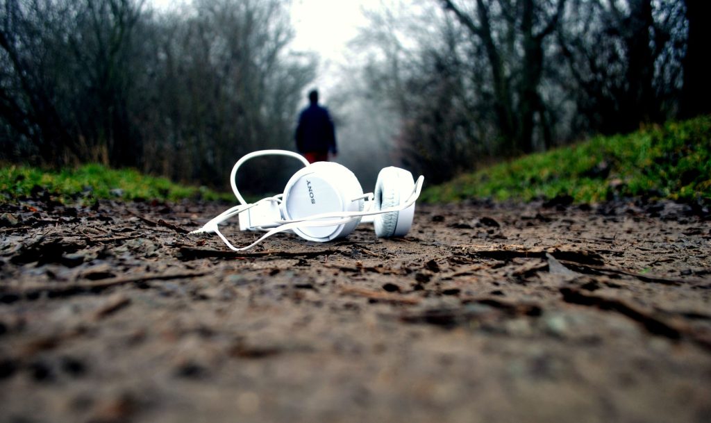 Headphones abandoned on rough ground